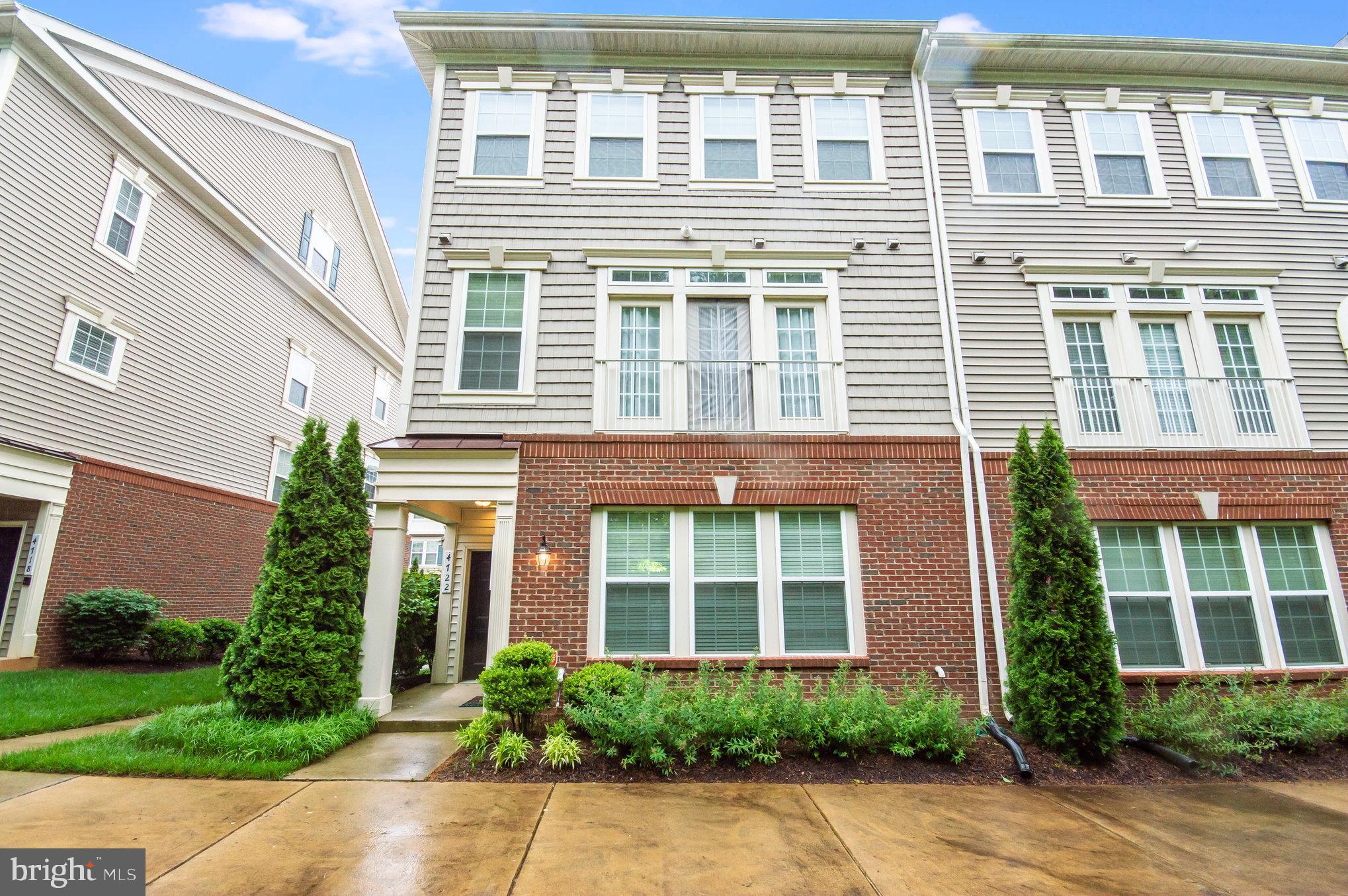 4722 Dane Ridge Circle Woodbridge, VA 22193 - Photo 1 of 28 a front view of a building with a yard