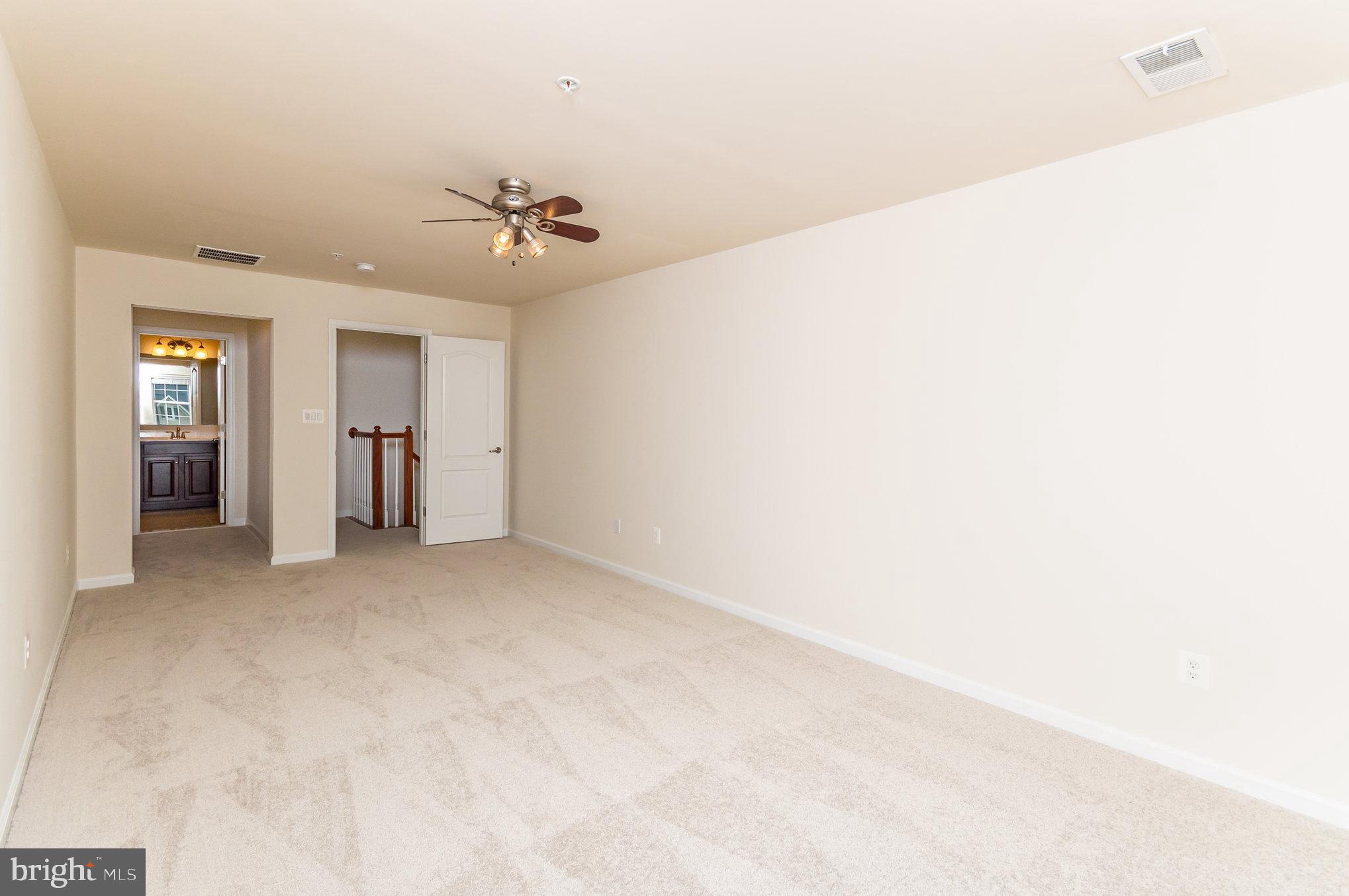 4722 Dane Ridge Circle Woodbridge, VA 22193 - Photo 12 of 28 a view of a big room with windows and chandelier fan