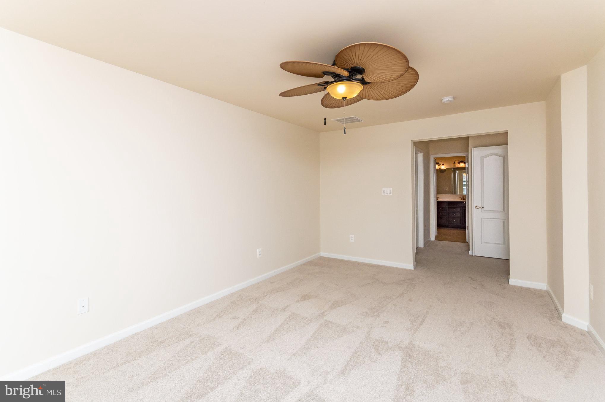 4722 Dane Ridge Circle Woodbridge, VA 22193 - Photo 17 of 28 a view of an empty room and chandelier fan