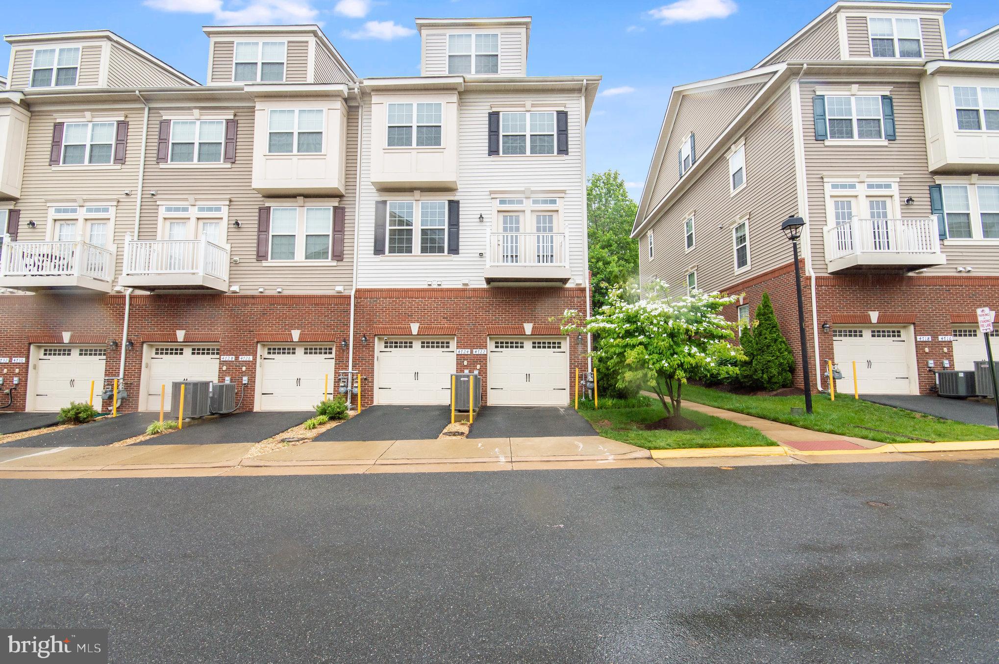 4722 Dane Ridge Circle Woodbridge, VA 22193 - Photo 22 of 28 a front view of a building with a street