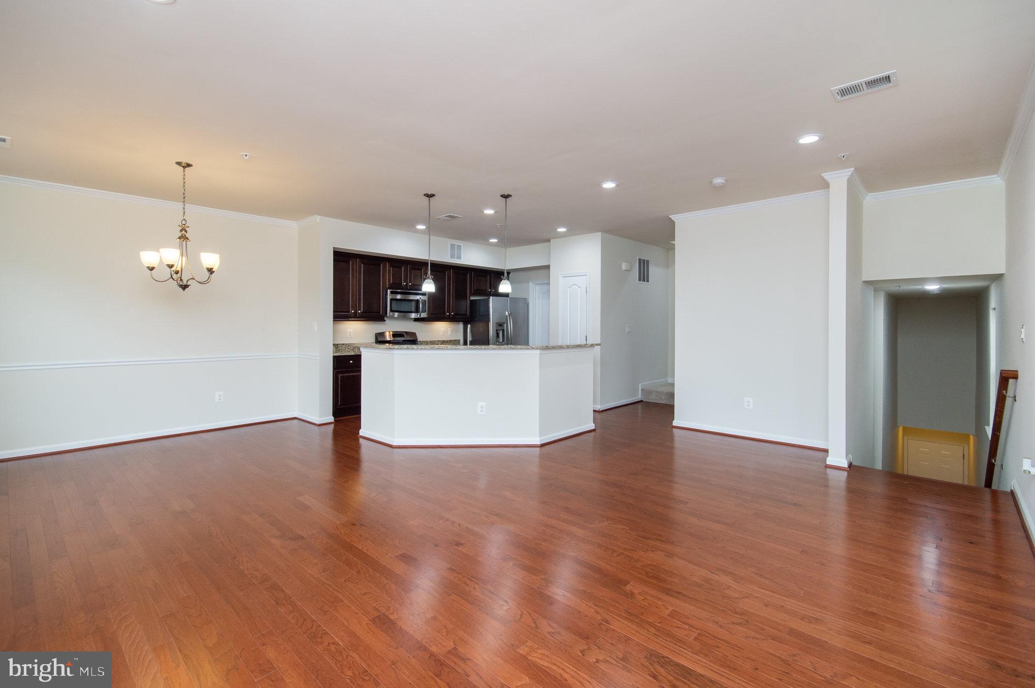 4722 Dane Ridge Circle Woodbridge, VA 22193 - Photo 6 of 28 a view of a kitchen with a sink and microwave