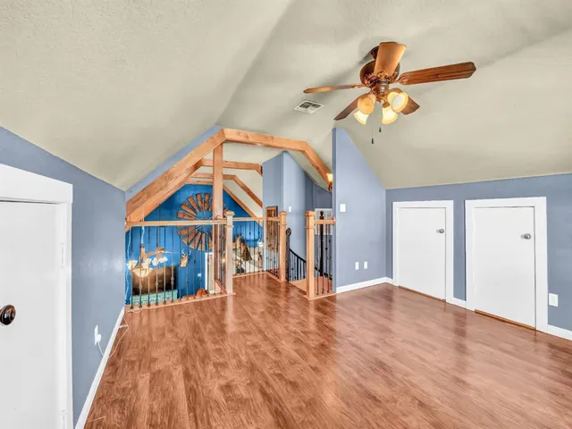 a view of a living room and a ceiling fan