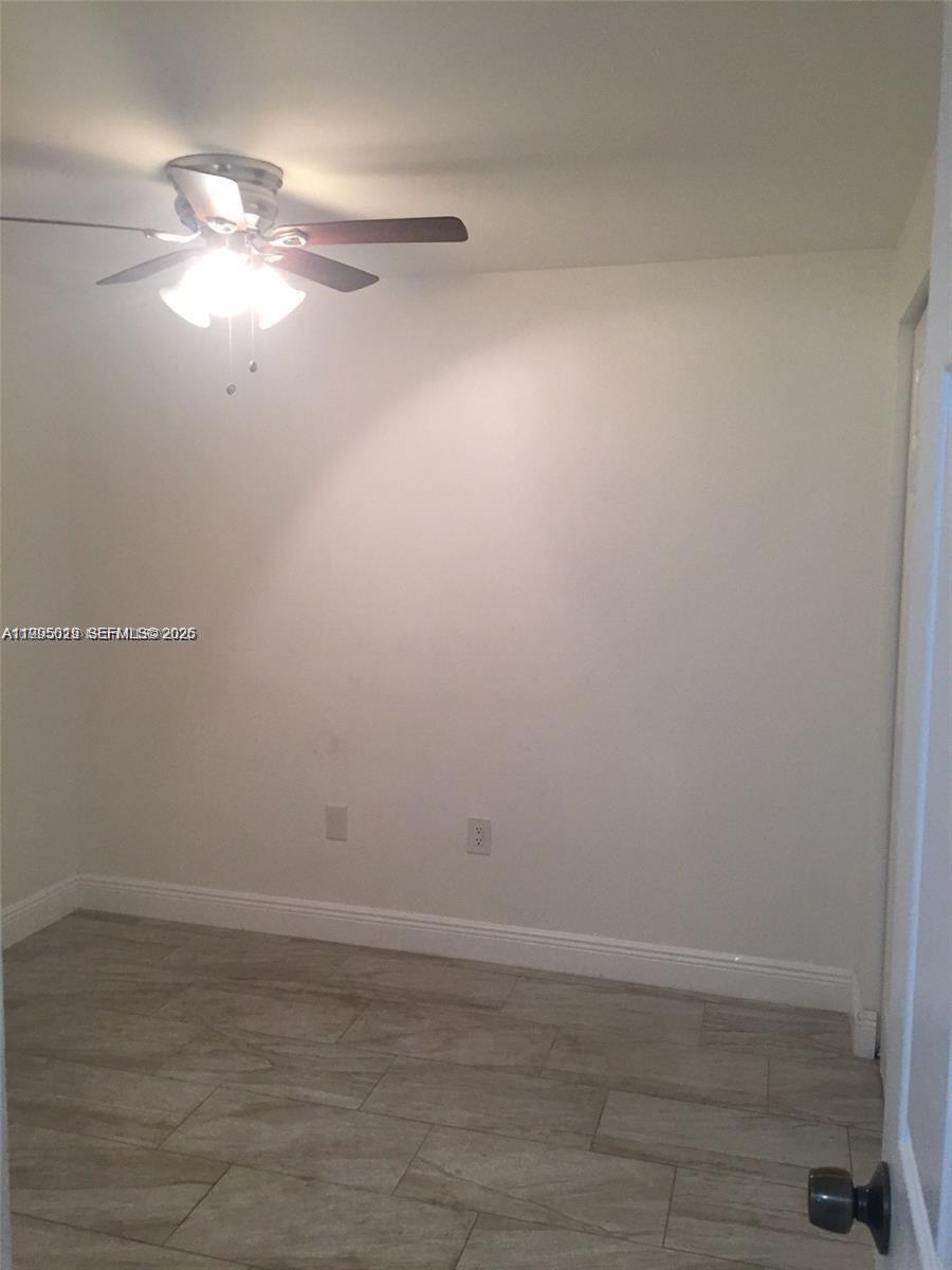 777 Southwest 9th Avenue, Unit 411 Miami, FL 33130 - Photo 11 of 14 a view of a room with an empty space and a window