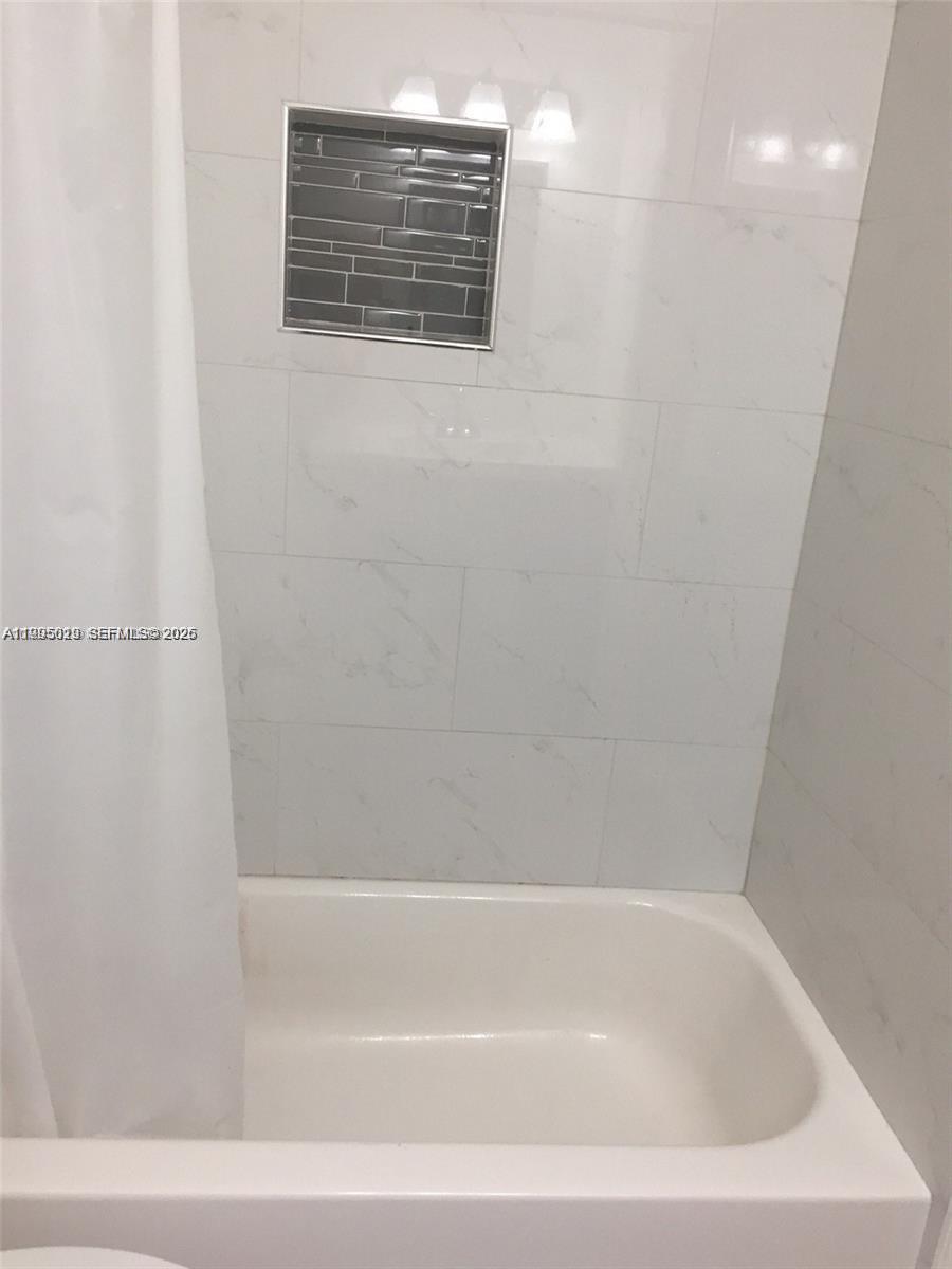 777 Southwest 9th Avenue, Unit 411 Miami, FL 33130 - Photo 8 of 14 a bathroom with a shower