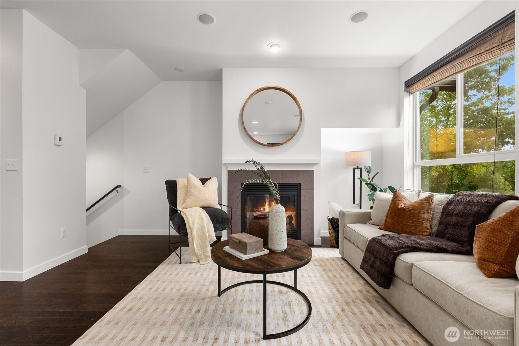 16516 2nd Park Southeast Bothell, WA 98012 - Photo 6 of 39 a living room with furniture a fireplace and a large window