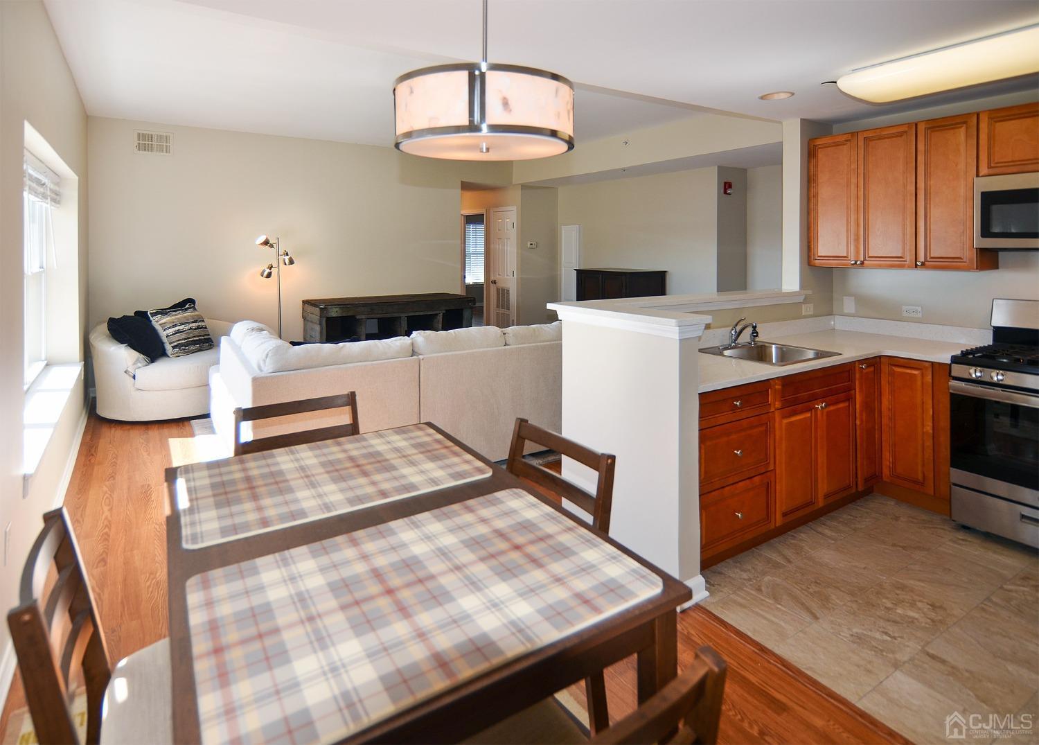 358 Rector Street, Unit 701 Perth Amboy, NJ 08861 - Photo 3 of 22 Dining room kitichen and living room view