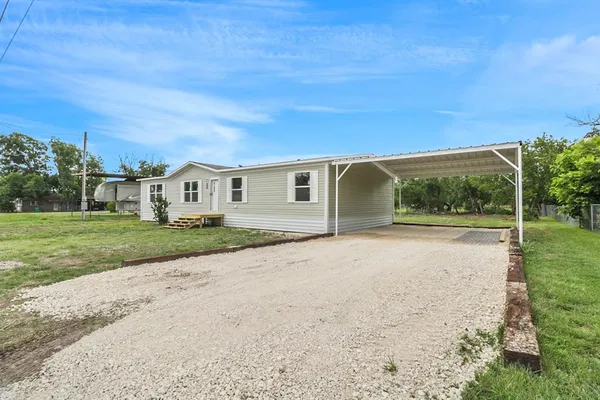 a house with yard in front of it