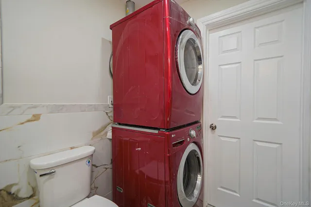a view of a hallway with stairs and wooden floor