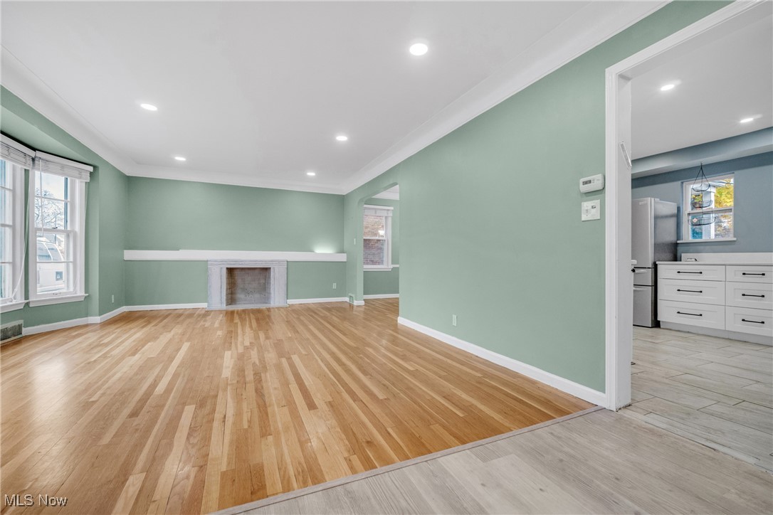 4430 Silsby Road Cleveland, OH 44118 - Photo 11 of 43 Unfurnished living room with light hardwood / wood-style flooring and plenty of natural light
