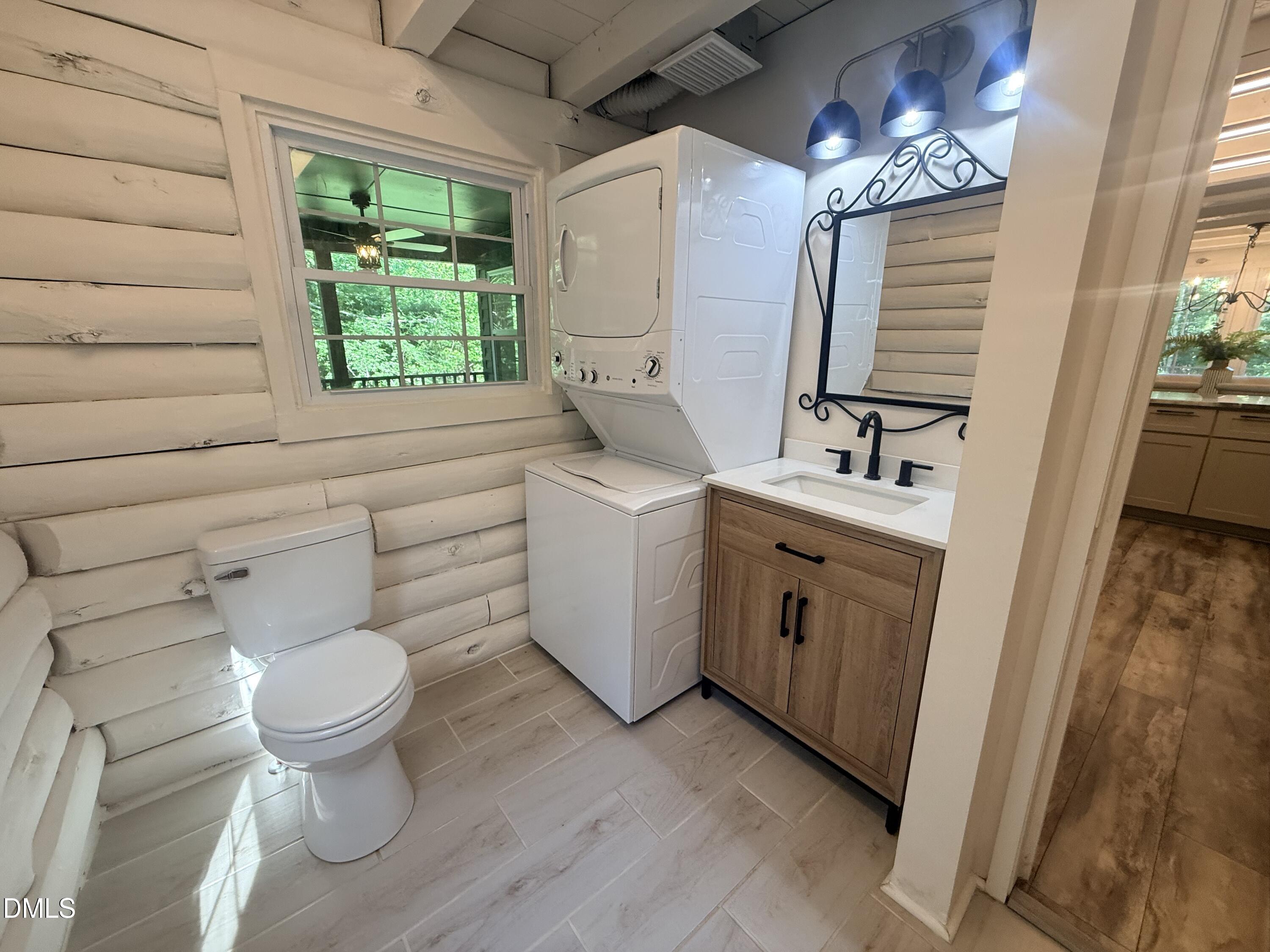 327 Shady Oak Road Roxboro, NC 27574 - Photo 32 of 62 a bathroom with a toilet sink and mirror