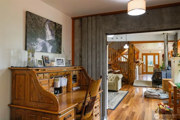 a bedroom with furniture and wooden floor