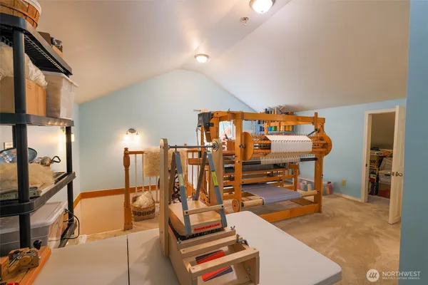 a view of a livingroom with furniture and a flat screen tv