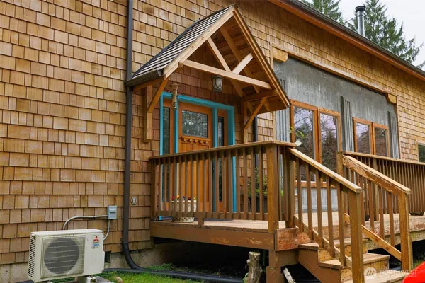 a view of wooden house with a small space