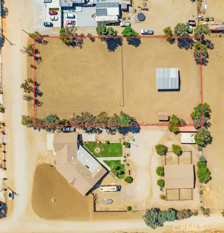 an aerial view of a house with a swimming pool