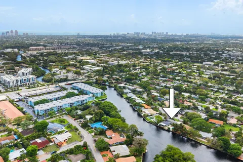 an aerial view of residential building and lake