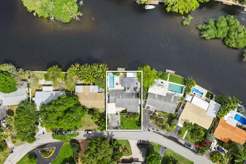 an aerial view of a house with a yard outdoor seating