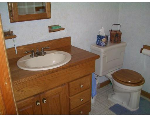 15 Rounseville Road Rochester, MA 02770 - Photo 5 of 15 a bathroom with a sink a toilet and mirror