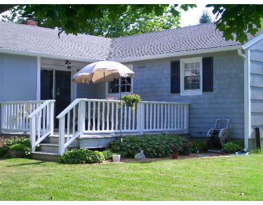 15 Rounseville Road Rochester, MA 02770 - Photo 8 of 15 a view of a house with a yard and furniture