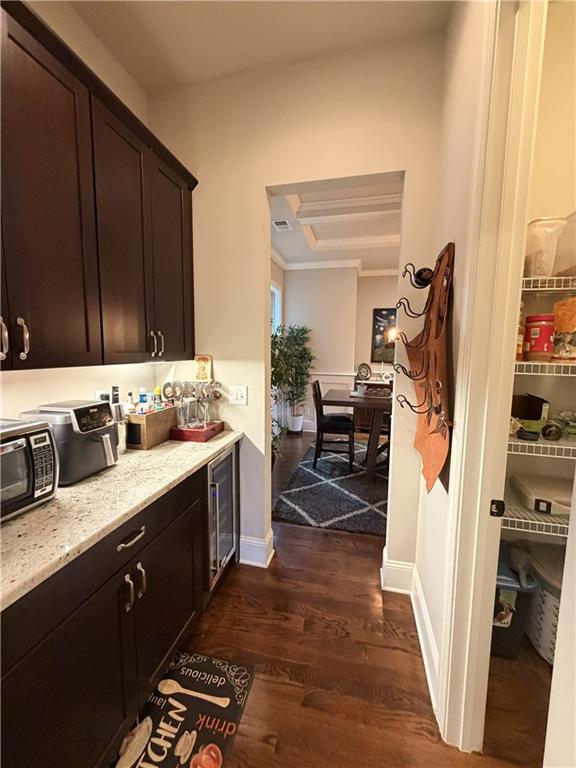 3151 Osborne Road Northeast Brookhaven, GA 30319 - Photo 14 of 54 a kitchen with stainless steel appliances granite countertop a refrigerator a sink dishwasher and wooden cabinets with wooden floor