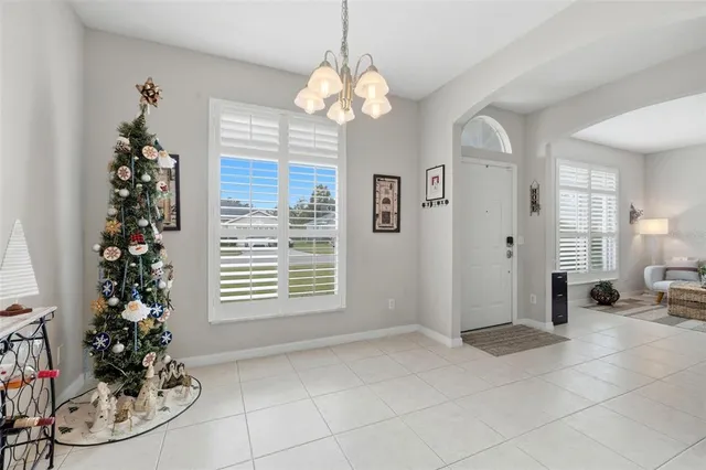 a kitchen with white cabinets stainless steel appliances and sink