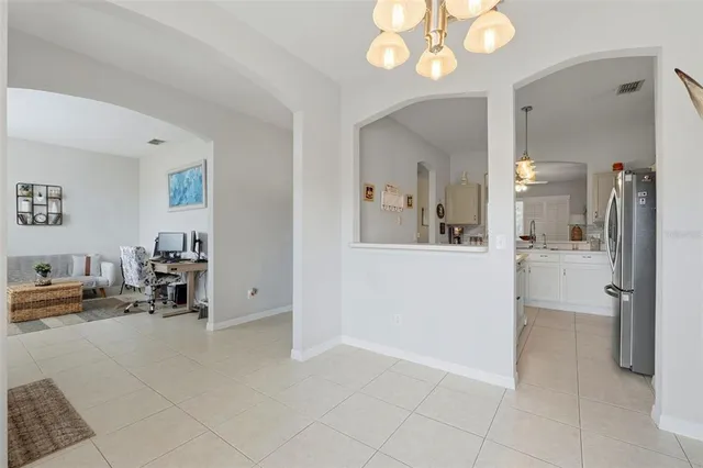 a kitchen with a table and chairs in it