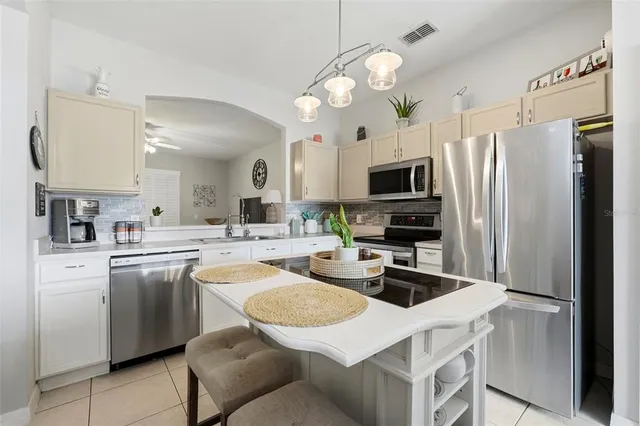 a bedroom with furniture and a large window