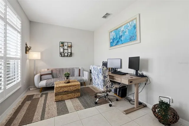 a view of a livingroom with furniture and a chandelier