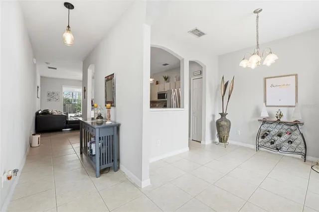 a living room with furniture a rug and a table