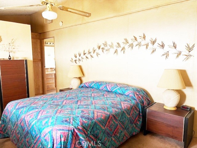 14851 Jeffrey Road, Unit 331 Irvine, CA 92618 - Photo 7 of 12 a bedroom with a bed and a chandelier