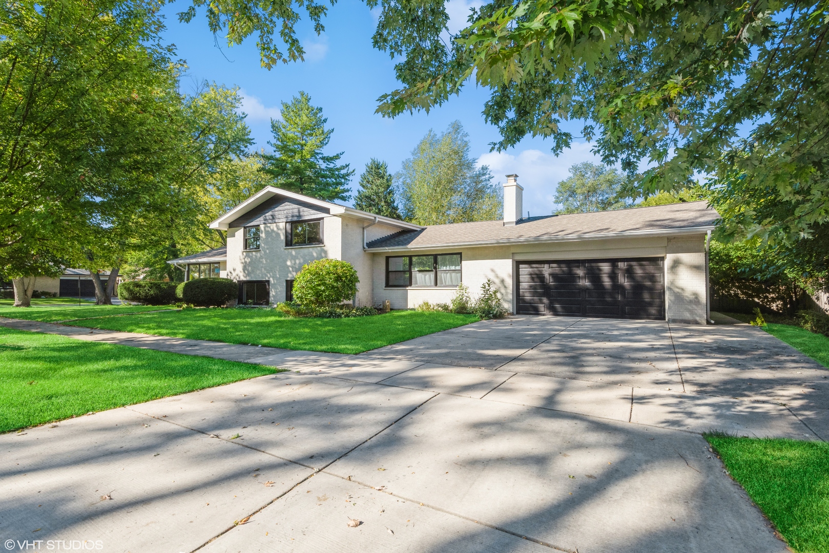 725 Locust Road Wilmette, IL 60091 - Photo 1 of 20 a front view of a house with garden