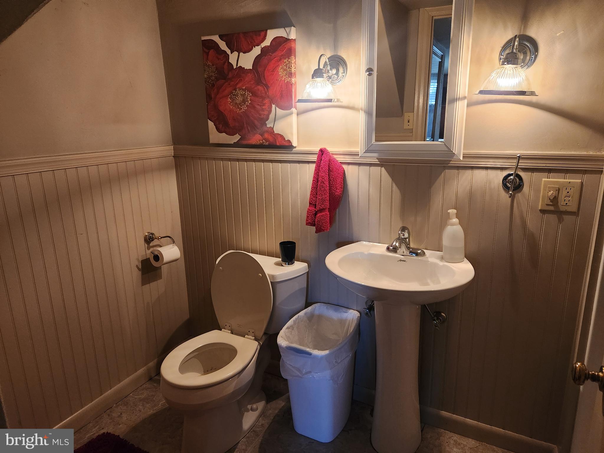 444 Donegal Springs Road Mount Joy, PA 17552 - Photo 5 of 29 a bathroom with a toilet sink and mirror