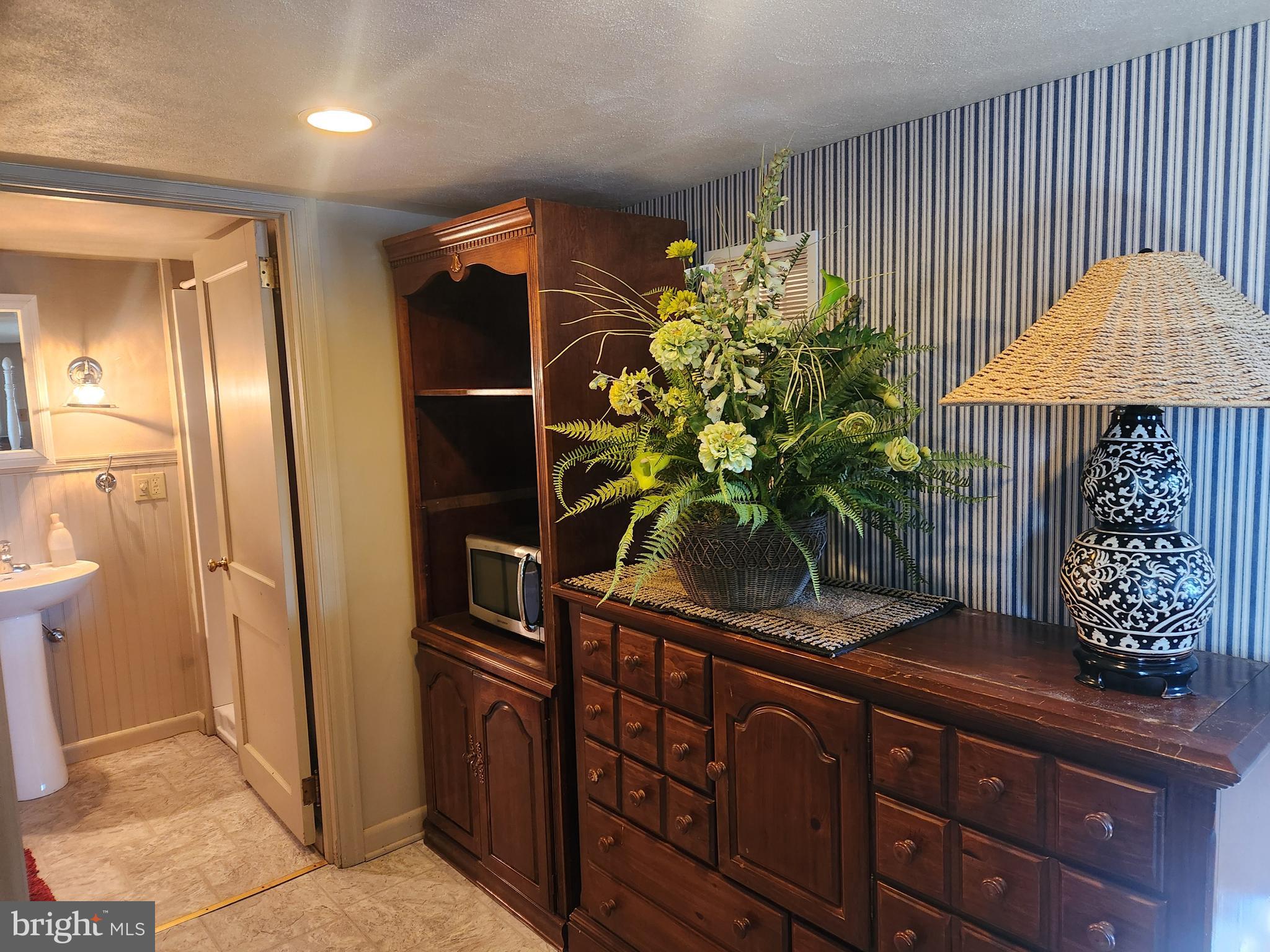 444 Donegal Springs Road Mount Joy, PA 17552 - Photo 6 of 29 a potted plant sitting in front of a door