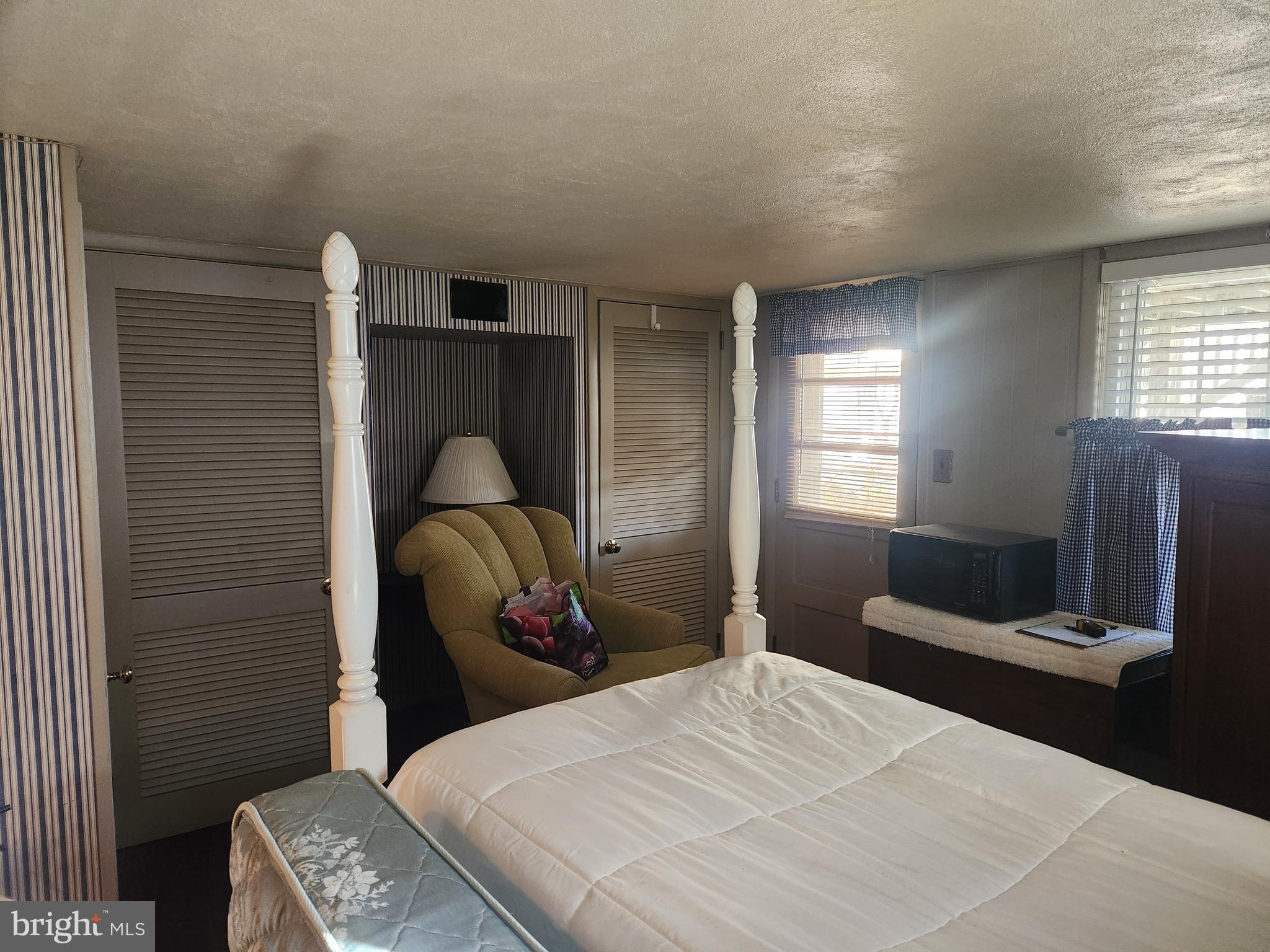 444 Donegal Springs Road Mount Joy, PA 17552 - Photo 7 of 29 a bedroom with a bed and a mirror