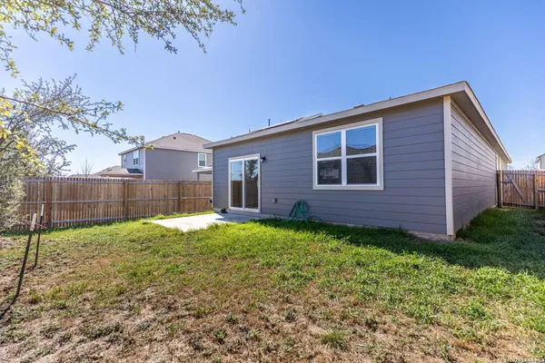a backyard of a house with lots of green space