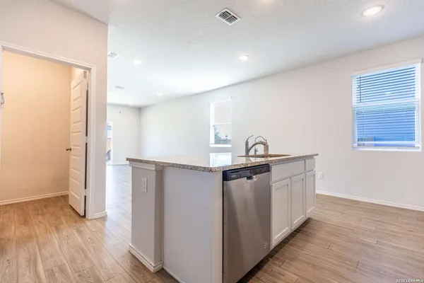 a view of kitchen with wooden floor
