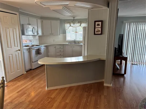 a view of a dining room with furniture and window