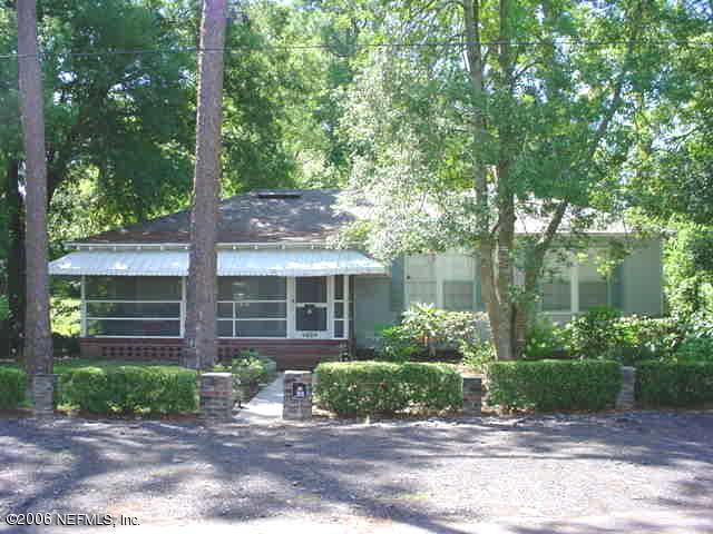 4824 Manchester Road Jacksonville, FL 32210 - Photo 1 of 10 a front view of a house with garden