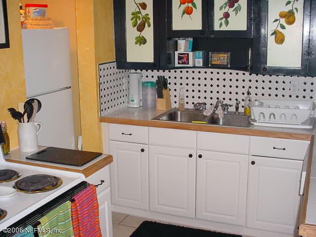4824 Manchester Road Jacksonville, FL 32210 - Photo 3 of 10 a bathroom with a sink and a mirror