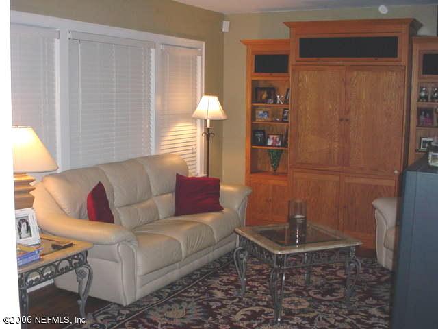 4824 Manchester Road Jacksonville, FL 32210 - Photo 5 of 10 a living room with furniture and a window