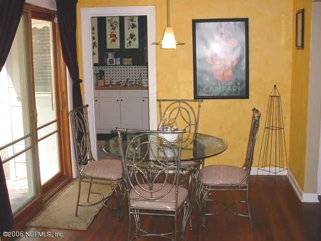 4824 Manchester Road Jacksonville, FL 32210 - Photo 6 of 10 a view of a dining room with furniture and wooden floor