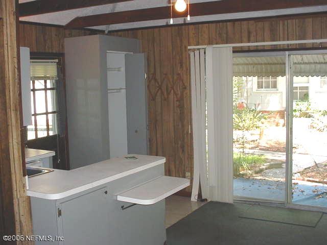 4824 Manchester Road Jacksonville, FL 32210 - Photo 9 of 10 a room with a window and a ceiling fan
