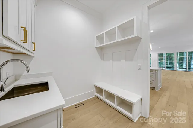 a room with a stove and a refrigerator