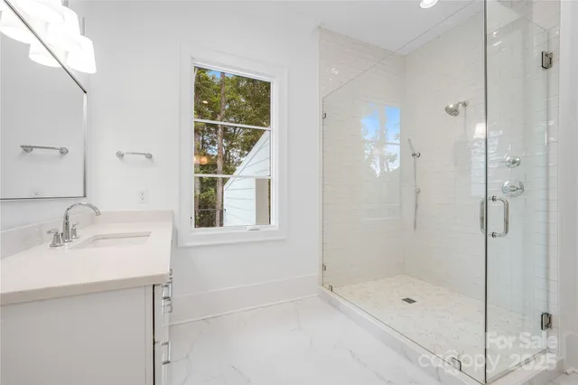 a kitchen with white cabinets