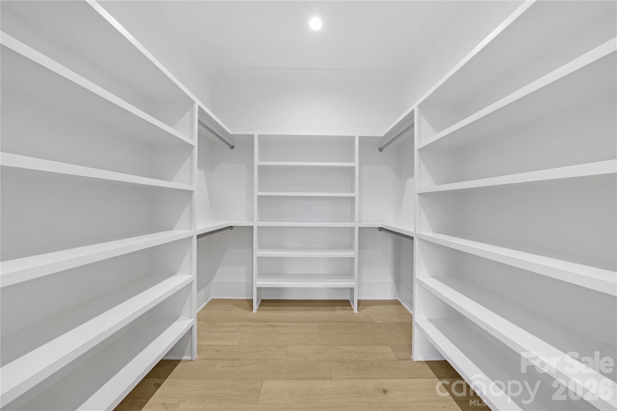 5035 Gilchrist Road, Unit 1B Charlotte, NC 28211 - Photo 37 of 46 a view of an empty walk in closet