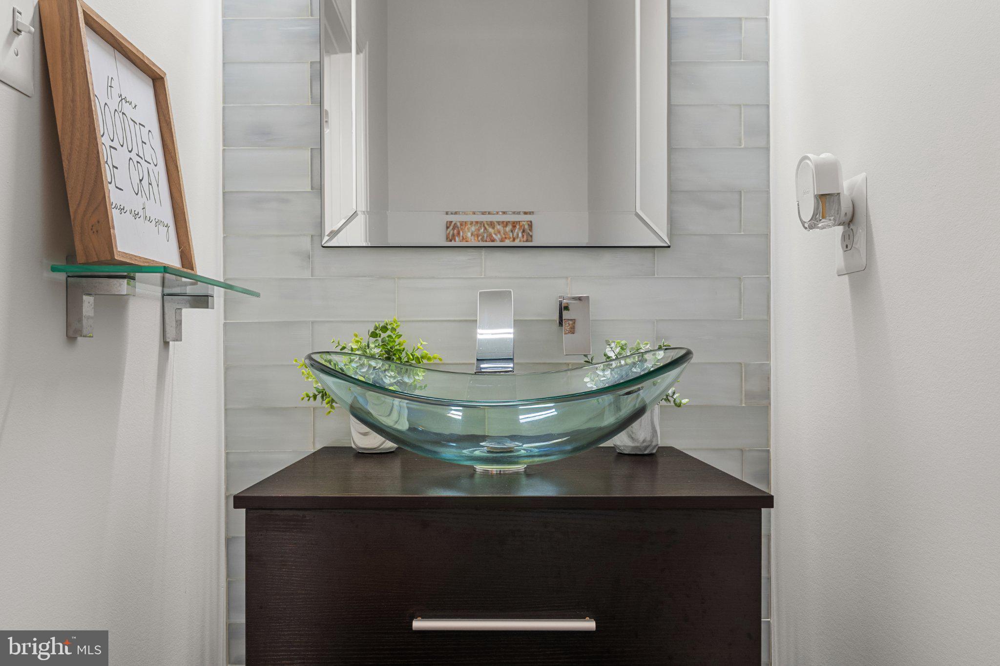 4554 Coachmans Path Court Waldorf, MD 20601 - Photo 14 of 40 Sleek modern bathroom with glass accents.