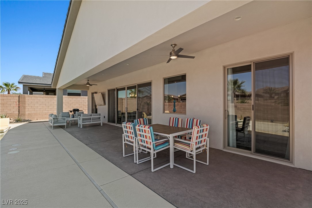1357 Manassas Ridge Mesquite, NV 89027 - Photo 46 of 72 View of patio / terrace with ceiling fan, an outdoor living space, and outdoor dining space