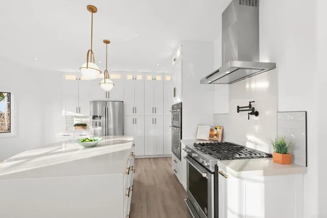 a bedroom with a large bed and a large window