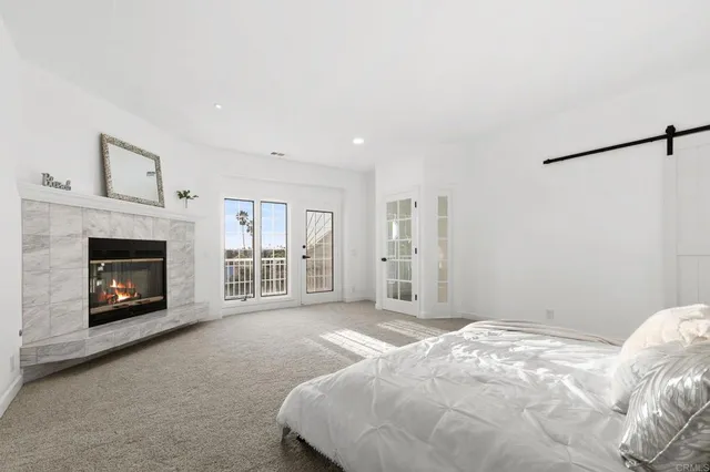 a bathroom with a tub sink shower and mirror