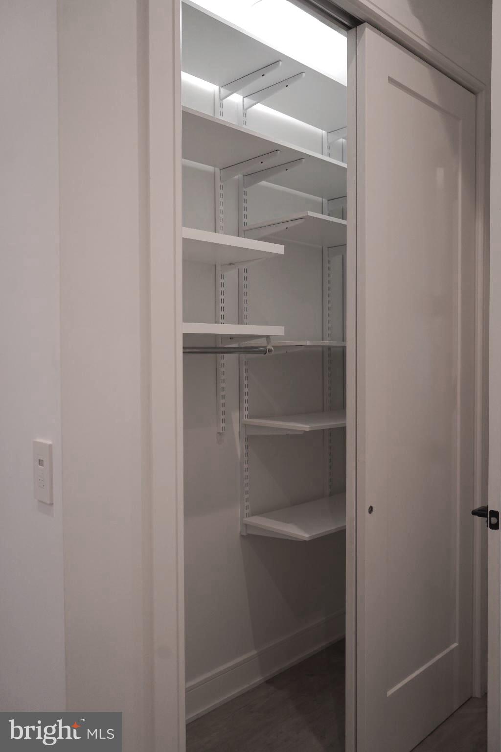 725 Euclid Street Northwest, Unit 2 Washington, DC 20001 - Photo 11 of 14 a view of walk in closet with empty racks