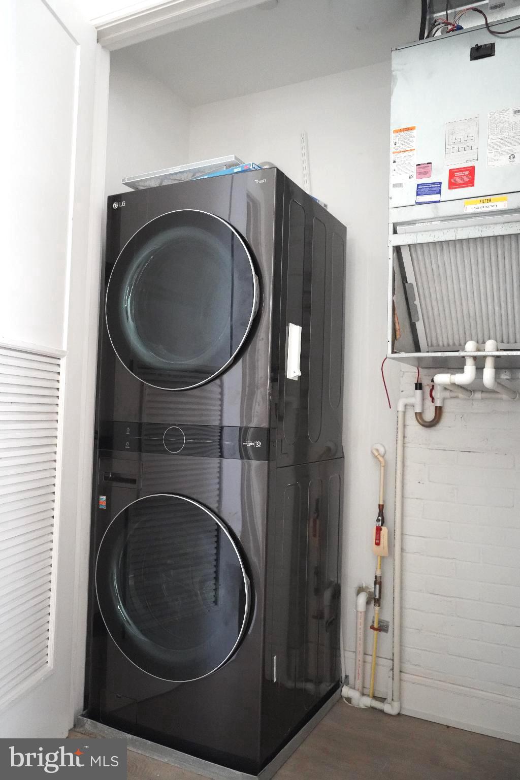 725 Euclid Street Northwest, Unit 2 Washington, DC 20001 - Photo 7 of 14 a utility room with dryer and washer